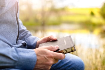 man holding bible